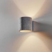 Ara-væglampe som en betoncylinder