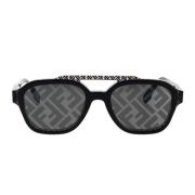 Glamourøse geometriske solbriller med sort acetatramme og grå linser
