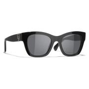 Ikoniske solbriller med grå linser