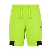 Fluorescerende gule shorts med kontrastdetaljer