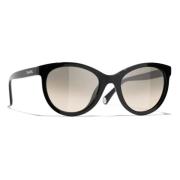 Ikoniske solbriller med grå gradient linser