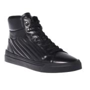 Trainers in black quilted leather and leather