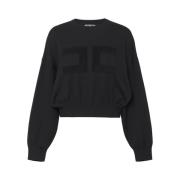 Sort sweater med forfine detaljer