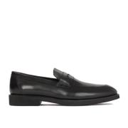 Minimalistiske sorte loafers med behagelig sål