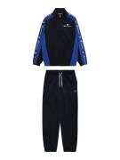 Champion Authentic Athletic Apparel Joggingdragt  royalblå / mørkeblå ...